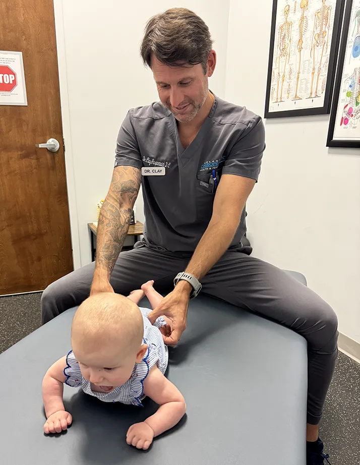 Chiropractor Rock Hill SC Clay Gasparovich Adjusting An Infant